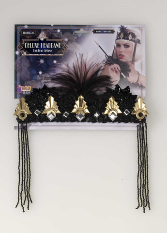 1920's Black and Gold Flapper Headband Costume Accessory shown in packaging, featuring a wide black headband decorated with metallic gold Art Deco–style embellishments, including fan‑shaped accents, gold details, and faceted faux gemstone elements arranged across the front; centered with a soft black feather plume that rises upward for dramatic effect, accented on each side by dangling strands of black beads that frame the face and move with motion, shown with smaller feather