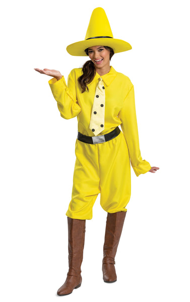 Woman in the Adults Curious George Person In The Yellow Hat Costume featuring a bright yellow long‑sleeve shirt styled with a pointed collar and a clip-on tie printed with bold black polka dots for a clean, character‑accurate look. The costume includes matching yellow pants with a relaxed fit, a wide black belt, and a tall structured yellow hat with a wide brim and black band that completes the instantly recognizable silhouette.