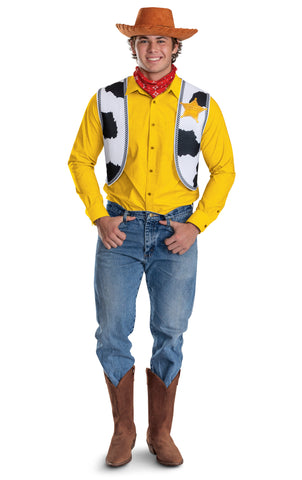 Man in the Adults Disney Pixar Toy Story Woody Costume Accessory Kit featuring a coordinated set of classic Woody pieces, including a brown wide‑brim cowboy hat with stitched detailing around the edge, a red bandana with white print, and a cow‑print vest panel designed with black‑and‑white patterning and a printed sheriff badge on the chest.