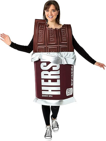 Woman wearing a Hershey's Chocolate Bar costume featuring an oversized tunic designed to resemble a classic Hershey’s milk chocolate bar, printed in rich brown tones with highly detailed “chocolate square” segments molded into the top portion and stamped with the HERSHEY’S logo; the lower half displays the iconic brown wrapper design with bold white “HERSHEY’S” lettering, “Since 1894” text, and a silver foil‑style trim printed around the waist and hem