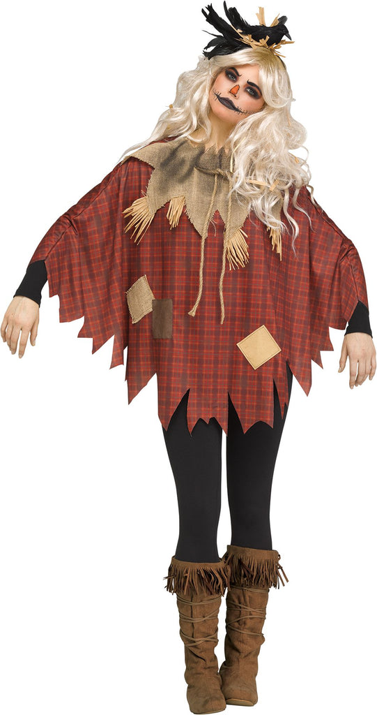 Woman posing in the Adults Scary Scarecrow Costume Poncho
featuring a loose, oversized poncho‑style top designed in a dark red and brown plaid pattern, styled with jagged, uneven cut edges along the sleeves and hem for a torn, weather‑worn effect; accented with stitched patchwork pieces in burlap‑style and fabric textures across the front. The neckline is finished with a distressed burlap collar and rope tie, along with straw‑style fringe details that add depth and a rugged harvest look