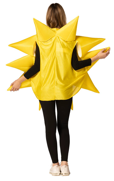 Back view of Woman in the Adults Sunny Day Giant Yellow Sun Costume Featuring a bright yellow polyfoam tunic designed in a circular sun shape with a smooth fabric surface and dimensional structure. The costume includes multiple pointed rays extending outward around the perimeter, along with a central round panel and side openings for arms. 