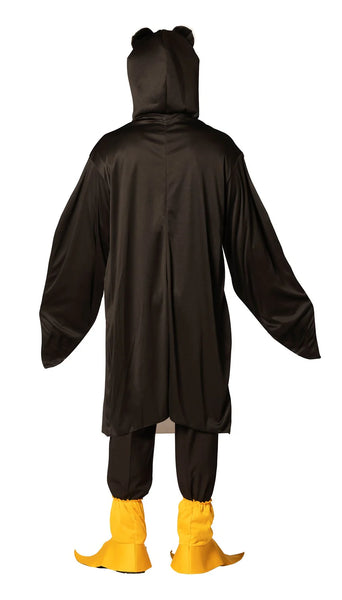 Back view of Man in the Adults Penguin Costume Featuring a black and white penguin tunic with a smooth fabric finish, designed with a white front panel and attached elongated wing-style sleeves. The costume includes an attached hood with a sculpted penguin beak and large cartoon-style eyes, along with a red bow tie at the neckline. Matching yellow penguin feet shoe covers slip over footwear, completing the look with webbed detailing and a soft, rounded shape.