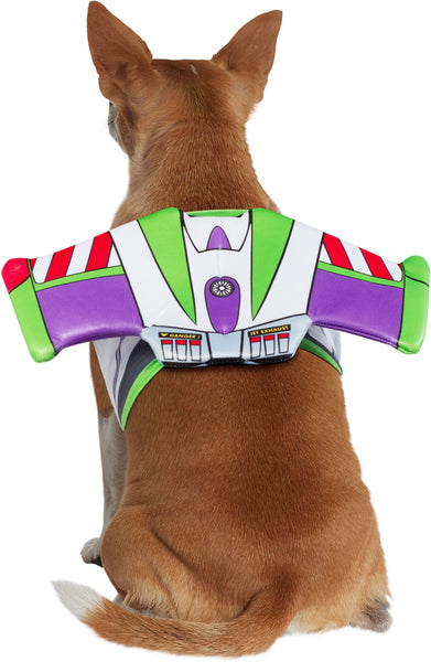 Back of chihuahua wearing Pets Disney Pixar Toy Story Buzz Lightyear Costume and Toy Kit  Buzz Lightyear’s iconic space ranger suit, styled with bold panels of white, green, purple, and red printed armor detailing across a wing‑shaped structure that sits neatly along the pet’s back; includes a coordinating plush green alien toy with three eyes, pointed ears, and a blue outfit printed with the Pizza Planet logo, completing the playful Toy Story pairing