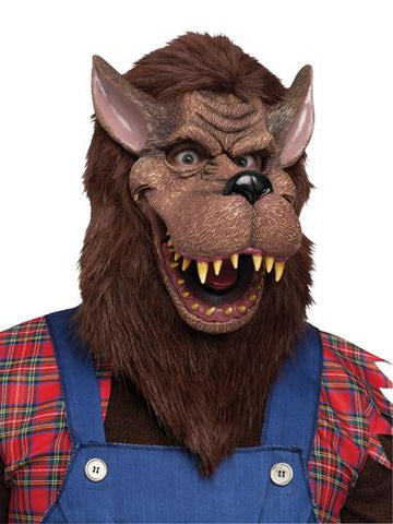 Big Bad Wolf Costume Mask features a full‑face molded mask designed in a rich brown faux‑fur finish, sculpted with exaggerated wolf features including a long protruding snout, wide open mouth, and sharp tooth detailing; the face includes defined wrinkle lines for added character. The mask is finished with shaggy brown faux‑fur hair around the sides and back, creating a full, wild silhouette that frames the head