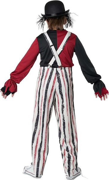 Back of Boy in the Boys Carnival Creepster Clown Costume Featuring a black bowler hat, a long-sleeve shirt with one red sleeve and one black sleeve, crisscrossing white suspenders on the back, and high-waisted overalls with vertical stripes in white, black, and red. The overalls include attached pom-pom accents on the front side and extend to full-length pant legs. Fingerless gloves with matching red and black color blocking cover the hands, and the outfit is paired with low-top sneakers.