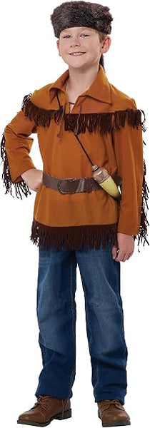 Boy posing in the Boys Davy Crockett Frontier Man Costume Featuring a frontier-style costume set including a brown long-sleeve shirt with a collar and fringe trim across the chest, shoulders, and sleeves, a coonskin-style hat with an attached tail detail, a brown belt worn at the waist, and a prop powder horn with a strap for crossbody wear.