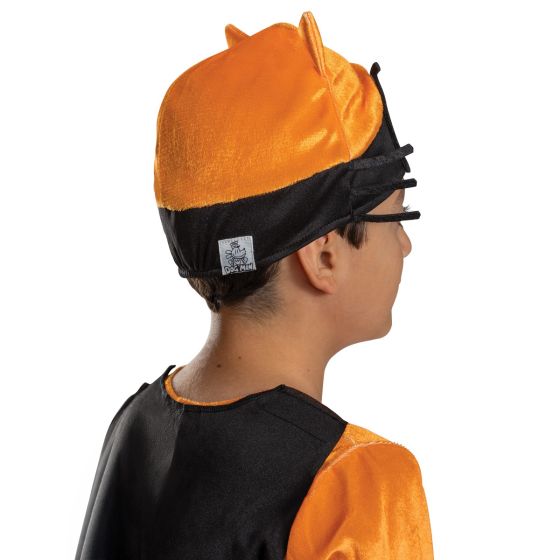 Back of Boy posing in the Boys Dog Man Cat Kid Costume Featuring a full-body jumpsuit designed in bright orange with black horizontal stripe detailing, this costume includes a soft, plush-like fabric texture and a printed “Cat Kid” emblem at the neckline. The set also includes a black cape with a pointed hem attached at the shoulders, an orange headpiece with attached cat ears and mesh eye panels with whisker detailing, and a pair of felt claws worn with elastic bands for hand placement.