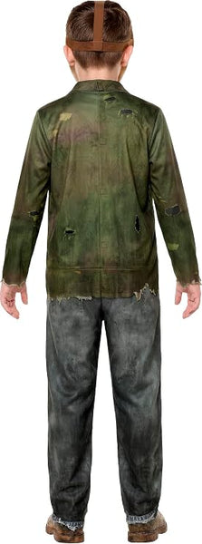 Back view of a boy in the  Friday the 13th Jason Voorhees Costume Featuring and off-white hockey-style mask with cutout eye openings, multiple ventilation holes, red painted accent markings, and an adjustable brown head strap, along with a printed jumpsuit designed to look like a distressed olive-green jacket layered over a worn shirt and attached matching gray printed pants with weathered detailing, torn-effect artwork, and an aged appearance