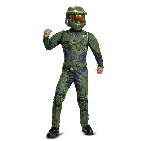 Boy posing in the Boys Xbox Halo Master Chief Costume Featuring a full-length jumpsuit printed with green and black armor panel graphics, this costume includes detailed design elements such as chest plating, joint sections, and battle-style markings throughout the front and back. The outfit is paired with a molded green mask featuring angular panel lines and a gold-tinted visor, with an elastic strap at the back for secure positioning.