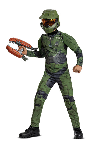 Boy posing in the Boys Xbox Halo Master Chief Costume Featuring a full-length jumpsuit printed with green and black armor panel graphics, this costume includes detailed design elements such as chest plating, joint sections, and battle-style markings throughout the front and back. The outfit is paired with a molded green mask featuring angular panel lines and a gold-tinted visor, with an elastic strap at the back for secure positioning, with plasma rifle prop