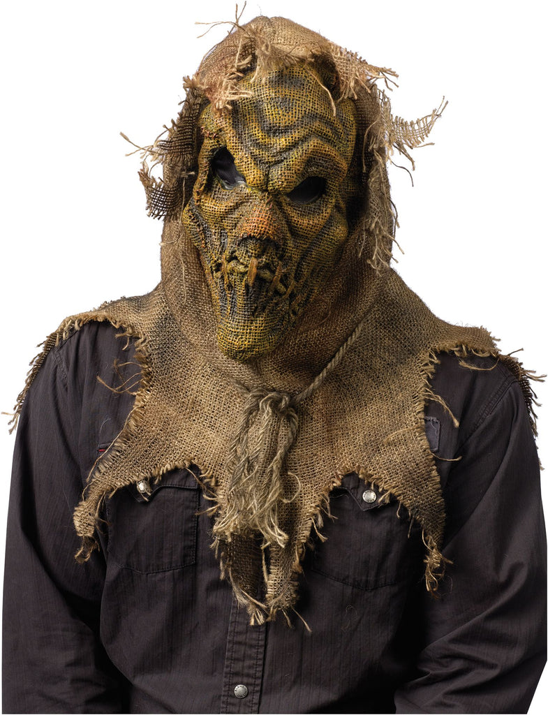 Burlap Sack Scarecrow Costume Mask featuring a full‑face mask constructed from distressed burlap‑style fabric in natural tan and weathered brown tones, sculpted with deep, wrinkled facial contours for a worn, stitched‑together appearance; designed with dark mesh eye openings, a stitched mouth detail with rough twine accents, and layered burlap patches across the face. The mask is finished with an attached tattered burlap hood and collar with frayed edges that extend down over the shoulders