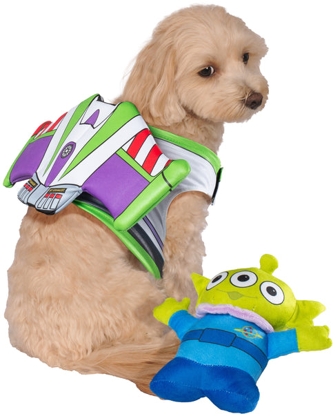 Cavapoo wearing Pets Disney Pixar Toy Story Buzz Lightyear Costume and Toy Kit featuring  Buzz Lightyear’s iconic space ranger suit, styled with bold panels of white, green, purple, and red printed armor detailing across a wing‑shaped structure that sits neatly along the pet’s back; includes a coordinating plush green alien toy with three eyes, pointed ears, and a blue outfit printed with the Pizza Planet logo, completing the playful Toy Story pairing
