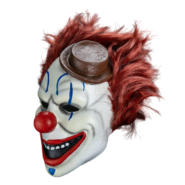 Clown in a Cornfield Frendo the Clown Costume Mask features a full‑coverage latex sculpt with a smooth, clean clown face design, bright white skin tone, bold blue accents around the eyes and mouth, gray wrinkle details, sharply defined red nose, pronounced cheek structure, a wide unsettling grin, and attached styled dark red hair and little brown hat, left profile