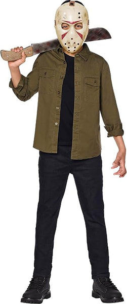 A child modeling a Friday the 13th Jason Voorhees accessory kit which includes an off-white hockey-style mask with cutout eye openings, multiple round ventilation holes, red painted accent markings, and an adjustable brown head strap. The kit also includes a costume machete prop with a curved silver-colored blade, distressed scratch detailing, red painted accent marks, and a wood-look handle with molded grain texture and faux rivet details