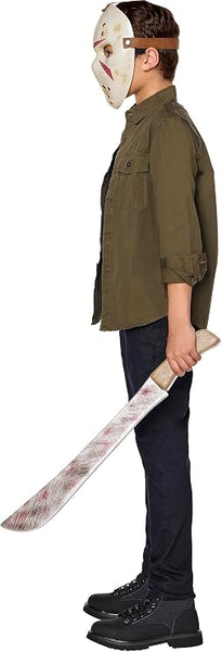 Side profile of a child modeling a Friday the 13th Jason Voorhees accessory kit which includes an off-white hockey-style mask with cutout eye openings, multiple round ventilation holes, red painted accent markings, and an adjustable brown head strap. The kit also includes a costume machete prop with a curved silver-colored blade, distressed scratch detailing, red painted accent marks, and a wood-look handle with molded grain texture and faux rivet details