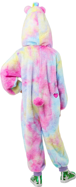 Back of Togetherness Bear Costume featuring soft, plush one‑piece jumpsuit covered in a pastel rainbow tie‑dye pattern blending pink, blue, yellow, and purple tones; a cozy hood shaped like the Togetherness Bear, complete with rounded bear ears, an embroidered smiling face, and small heart details on the cheeks. Front of the costume includes a white belly panel printed with the signature rainbow heart Care Bears symbol, while the back is finished with an attached fluffy pink bear tail and a small heart 