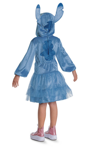 Back of Girl posing in Girls Disney's Lilo & Stitch Hooded Costume Dress
Features a soft blue dress designed with a fitted bodice and layered tulle skirt, styled in shimmer‑finish fabric with a lighter blue front panel and subtle printed detail. The dress includes long sleeves and an attached hood designed with Stitch’s face, complete with oversized ears lined in pink, creating an instantly recognizable silhouette.