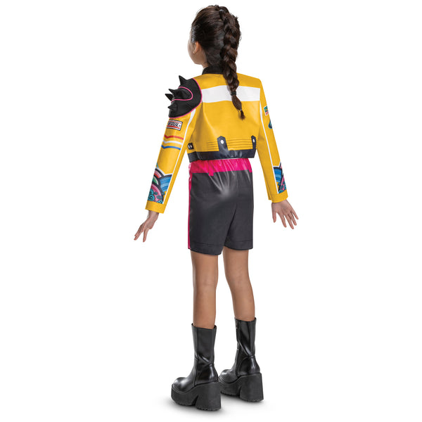 Back of Girl wearing Girls K-Pop Demon Hunters Rumi Costume Features a cropped yellow jacket with black trim and vibrant printed graphics across the sleeves and chest, paired with coordinating romper with black shorts accented by a bright pink waistband and zipper detail, and white top. The jacket is styled with dramatic elements like a sculpted spiked shoulder piece and layered printed designs in teal, purple, and multicolor patterns.