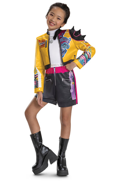 Girl wearing Girls K-Pop Demon Hunters Rumi Costume Features a cropped yellow jacket with black trim and vibrant printed graphics across the sleeves and chest, paired with coordinating romper with black shorts accented by a bright pink waistband and zipper detail, and white top. The jacket is styled with dramatic elements like a sculpted spiked shoulder piece and layered printed designs in teal, purple, and multicolor patterns.