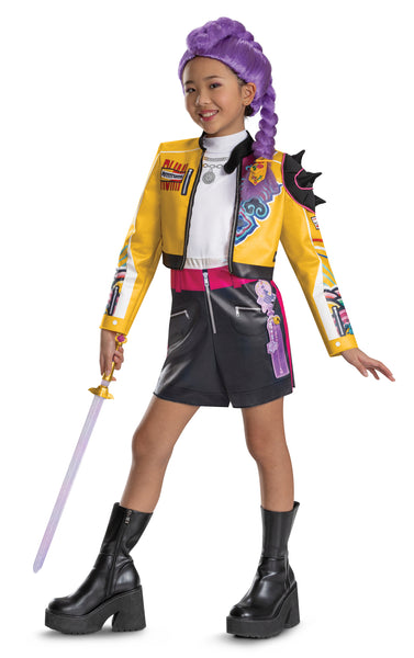 Girl wearing Girls K-Pop Demon Hunters Rumi Costume Features a cropped yellow jacket with black trim and vibrant printed graphics across the sleeves and chest, paired with coordinating romper with black shorts accented by a bright pink waistband and zipper detail, and white top. The jacket is styled with dramatic elements like a sculpted spiked shoulder piece and layered printed designs in teal, purple, and multicolor patterns, with coordinating purple braided wig and sword.