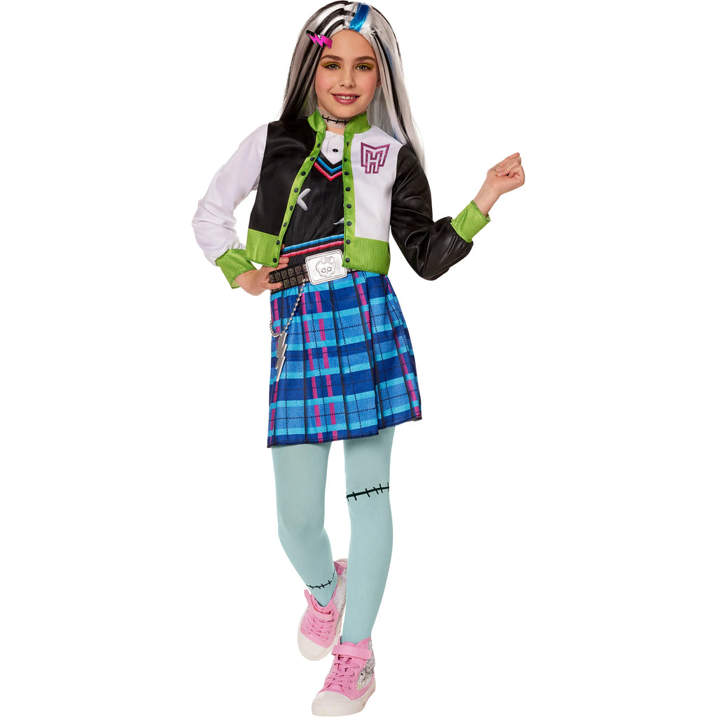Girl posing in the Girls Monster High Frankie Stein Costume Featuring a layered costume set including a black, white, and neon green cropped jacket with color-blocked panels and printed emblem on the back, a dress with a fitted bodice and blue plaid skirt with pink accents, a black choker with stitch detail, light blue tights with printed stitch marks, and a black belt with a silver buckle and chain accent.