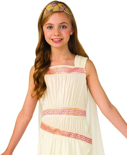 A girl posing showing the top of the Girls Roman or Greek Toga Costume which features a classic one‑shoulder white toga‑style dress designed with a softly draped, flowing silhouette, accented with elegant pink and gold Greek‑key trim bands across the shoulder strap, bodice, and waistline that add structure and visual contrast. The look is completed with a matching gold‑tone leaf headband that sits across the forehead, reinforcing the traditional ancient‑world aesthetic
