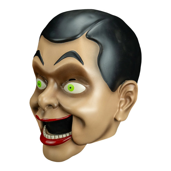 Goosebumps Night of the Living Dummy Slappy the Dummy Vinyl Costume Mask features a vinyl mask with three-dimensional sculpt, showcasing Slappy's unmistakable wide grin, arched eyebrows, sharp cheek lines, slicked-back brown hair, and bold painted details, left profile
