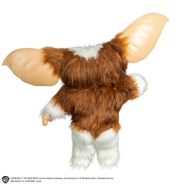 Gremlins Gizmo Mogwai Costume Prop Doll features a screen inspired doll with oversized, posable ears, foam body with posable wire skeleton frame, expressive, inserted eyes, soft facial features, fluffy, brown and cream toned texturing, and Gizmo's signature but sweet-but-mischievous look, back view