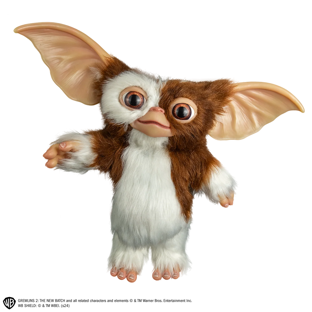 Gremlins Gizmo Mogwai Costume Prop Doll features a screen inspired doll with oversized, posable ears, foam body with posable wire skeleton frame, expressive, inserted eyes, soft facial features, fluffy, brown and cream toned texturing, and Gizmo's signature but sweet-but-mischievous look, front view