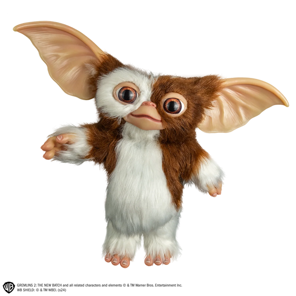 Gremlins Gizmo Mogwai Costume Prop Doll features a screen inspired doll with oversized, posable ears, foam body with posable wire skeleton frame, expressive, inserted eyes, soft facial features, fluffy, brown and cream toned texturing, and Gizmo's signature but sweet-but-mischievous look, front view