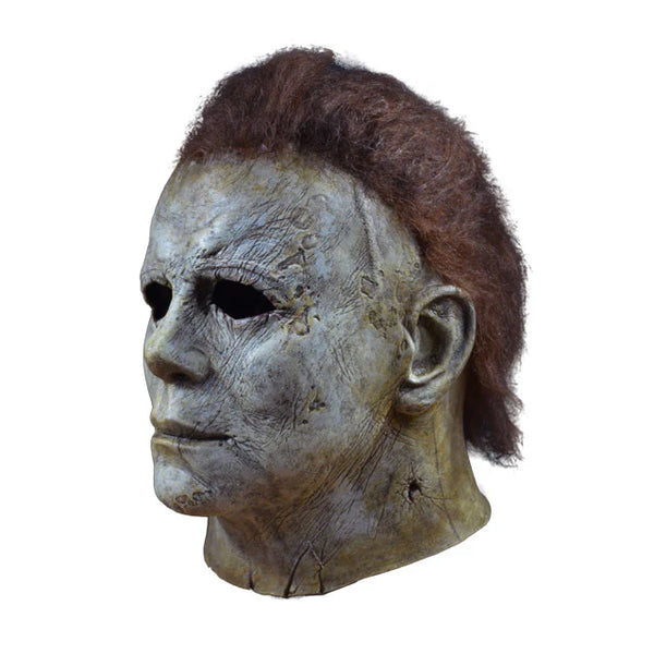 Halloween 2018 Movie Michael Myers Costume Mask features a screen accurate, latex, sculpt with aged, pale, lifeless finish, cut and weathered details, and rooted brown hair, left side profile