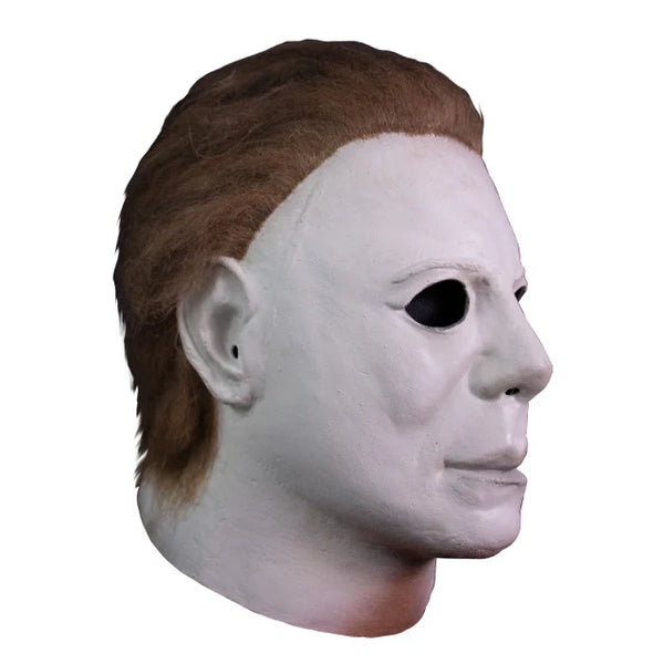 Halloween 4 The Return of Michael Myers Poster Costume Mask features a latex stylized sculpt with smooth, graphic facial contours, a cold, pale finish, hollow eyes, and attached hair, right side profile