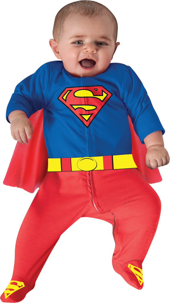 Baby wearing the Infants DC Universe Superman Costume Romper featuring a one‑piece red and blue romper styled to resemble Superman’s classic suit, with a bright blue upper section displaying the iconic red‑and‑yellow “S” shield on the chest and detachable red cape