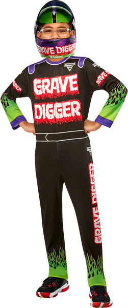 A child modeling a black racing-style costume jumpsuit with 'GRAVE DIGGER' printed in red and white across the chest, green and purple sleeve accents, flame graphics near the lower legs, and a matching helmet with the same text on the visor.