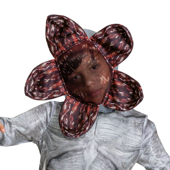 Close up of the headpiece in the Kids/Teens Stranger Things Demogorgon Costume Featuring a full-length gray jumpsuit with printed texture detailing designed to resemble the Demogorgon’s skin, this unisex costume includes long sleeves and a fitted silhouette with subtle patterning throughout the front and back. The set is paired with a character headpiece designed with a flower-like opening structure, featuring multiple petal-shaped sections with printed red interior detailing and layered graphic elements.