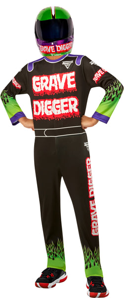 A child modeling a Grave Digger themed racing suit and helmet. The black racing suit features 'GRAVE DIGGER' printed in red and white across the chest, green flames near the bottom, and purple and green sleeve accents.