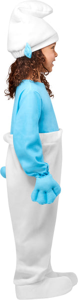 Side view of girl wearing Kids/Toddlers The Smurfs Smurf Costume which is two‑tone one‑piece outfit with a bright light‑blue long‑sleeve top and solid white pants, with built‑in blue mitten‑style hand covers at the sleeves and attached white shoe covers that extend over the feet, and it is completed with a tall white Smurf hat featuring blue Smurf ears attached at the sides