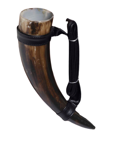 Medieval Fantasy Drinking Horn Costume Prop Accessory which features a curved horn‑style vessel with a natural brown finish that mimics real horn texture, designed with a smooth light‑colored interior opening at the top; accented with black faux‑leather wrap bands at the rim and base, plus an attached adjustable black shoulder strap secured with silver‑tone rings, allowing the horn to hang at the side for an authentic medieval look
