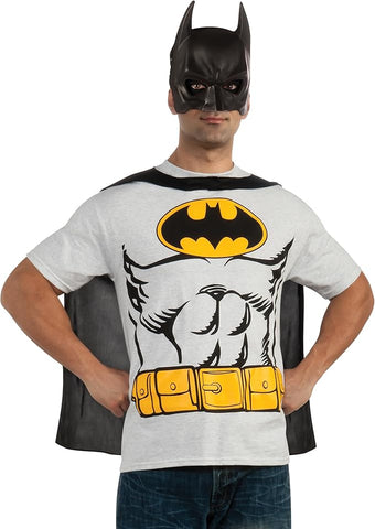Man wearing a short‑sleeve gray T‑shirt printed with a bold, comic‑style Batman chest graphic, including the iconic black‑and‑yellow bat emblem, stylized muscular torso illustration, and a bright yellow utility belt graphic across the waist; includes a detachable black fabric cape that drapes from the shoulders and a molded black Batman mask with pointed ears and open eye cutouts, completing the classic Dark Knight silhouette