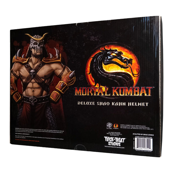 Mortal Kombat Shao Kahn injection-molded plastic skull helmet with sweeping horn details, sharply sculpted facial lines, a battle‑worn metallic finish, and deep, ominous eye openings, back view of packaging
