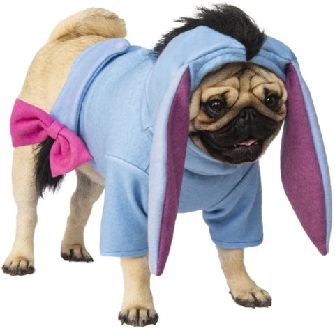 Pug dog modeling Pets Disney's Winnie the Pooh Eeyore Costume featuring gentle blue‑gray toned top with an attached hood showcasing long floppy ears, black mohawk fur, and Eeyore’s tail with its signature pink bow at the end