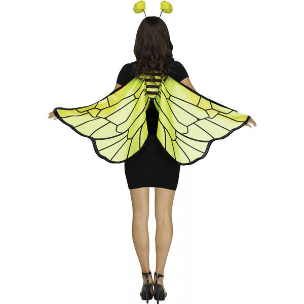 Back of a woman modeling the Soft Bumblebee Costume Accessory Kit featuring a pair of lightweight fabric wings and a matching headband; the wings are designed in a translucent yellow hue with bold black vein detailing and black edging, creating a realistic insect wing pattern. The wings drape across the arms to extend outward with movement and are secured by finger loops, while the headband includes two flexible antennae