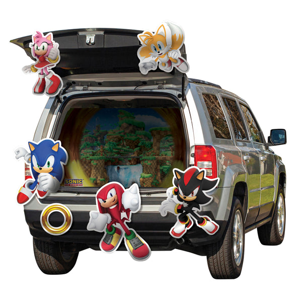 Sonic the Hedgehog Halloween Trunk or Treat Decoration Kit
Includes a vibrant, multi‑piece display set designed to transform a vehicle trunk into a scene inspired by the Sonic universe, including a large centerpiece backdrop printed with a bright Green Hill Zone landscape framed by a golden ring design. The kit also includes multiple cutout character graphics of Sonic, Tails, Knuckles, Amy, and Shadow, along with an additional ring that can be arranged around the trunk for a layered, immersive display 