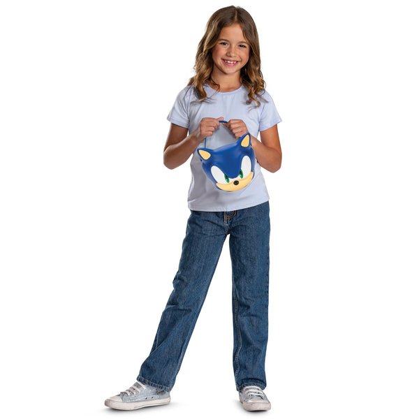 Gril with Sonic the Hedgehog Jumbo Trick or Treat Pail Bucket
Features a large, mold plastic bucket designed in the shape of Sonic’s iconic face, complete with bright blue coloring, oversized white eye panels, green iris details, and a signature smirk. The design includes raised contouring for added dimension, along with a sturdy curved handle across the top for easy carrying. The bucket measures approximately 7.5 inches tall and just under 8 inches wide, offering a roomy interior for candy or small items