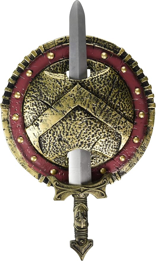 Spartan Warrior Combat Shield and Sword Costume Prop Weapon Set Featuring a round shield with a textured, hammered-metal appearance in gold and black tones, accented by a red outer ring with raised gold studs, and a central triangular emblem design, paired with a molded sword that fits vertically through the center, including a silver-toned blade and a detailed hilt with gold accents; the back of the shield includes attached black straps for holding and securing the set.