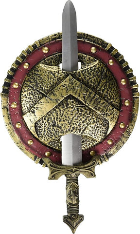Spartan Warrior Combat Shield and Sword Costume Prop Weapon Set Featuring a round shield with a textured, hammered-metal appearance in gold and black tones, accented by a red outer ring with raised gold studs, and a central triangular emblem design, paired with a molded sword that fits vertically through the center, including a silver-toned blade and a detailed hilt with gold accents; the back of the shield includes attached black straps for holding and securing the set.