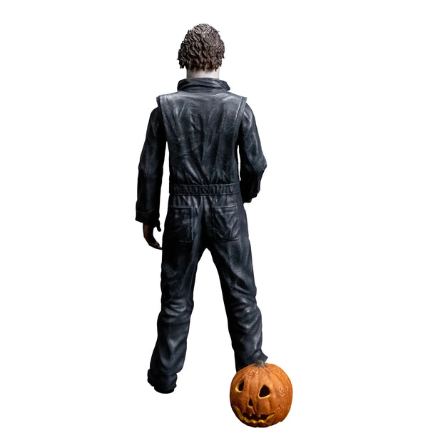 Halloween 1978 Michael Myers 8" Collector's Action Figure Collectible Toy in gray coveralls and white mask while holding a knife with jack-o-lantern accessory, back view
