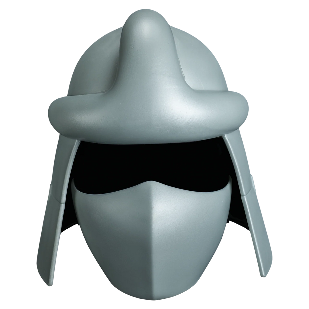 Teenage Mutant Ninja Turtles Shredder's Costume Helmet features injection‑molded sculpt with a sleek metallic silver finish, sharply angular contours, raised panel ridges, and Shredder’s signature bladed crest flaring upward and outward from the crown; includes narrow, aggressive eye slits and a smooth surface, front view