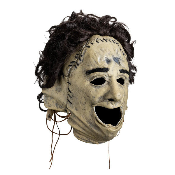 The Texas Chainsaw Massacre Killing Mask Vinyl Costume Mask vinyl Leatherface with skin stitched details and attached hair, right profile view